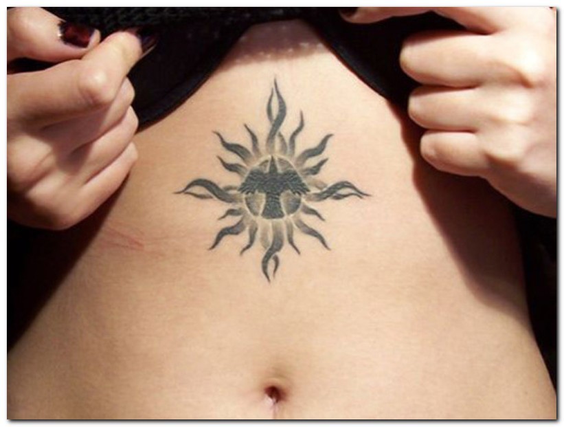 Beautiful Bird In Sun Tribal Tattoo On Stomach