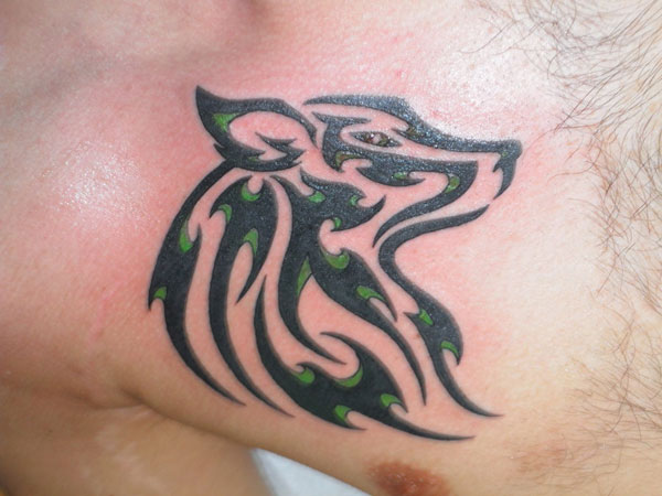 Beautiful Black And Green Tribal Wolf Head Tattoo On Right Chest