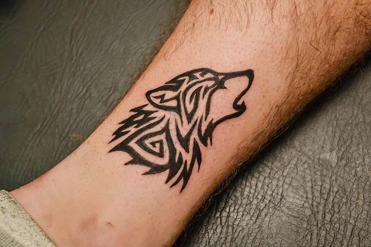 Beautiful Howling Tribal Wolf Head Tattoo On Wrist