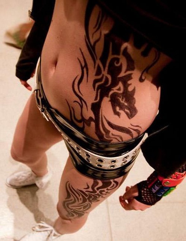 Beautiful Large Tribal Dragon Tattoo On Side Rib To Leg For Women