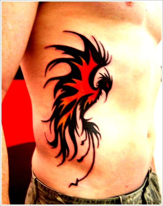 Beautiful Red And Black Tribal Bird Tattoo On Right Side Rib