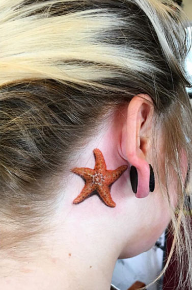 Beautiful Starfish Tattoo On Behind The Ear By Painless Steel