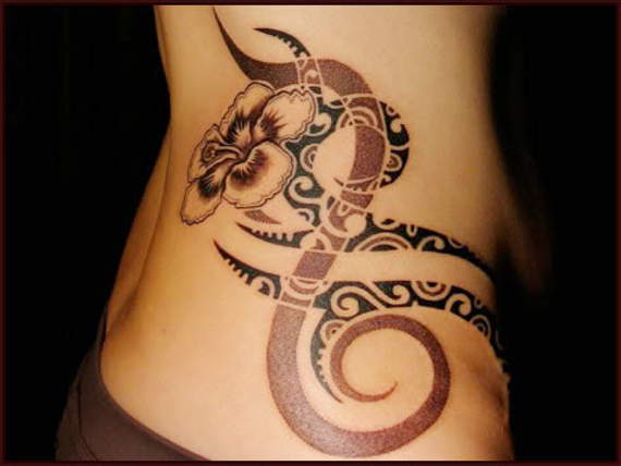 Beautiful Tribal Design With Flower Tattoo On Hip