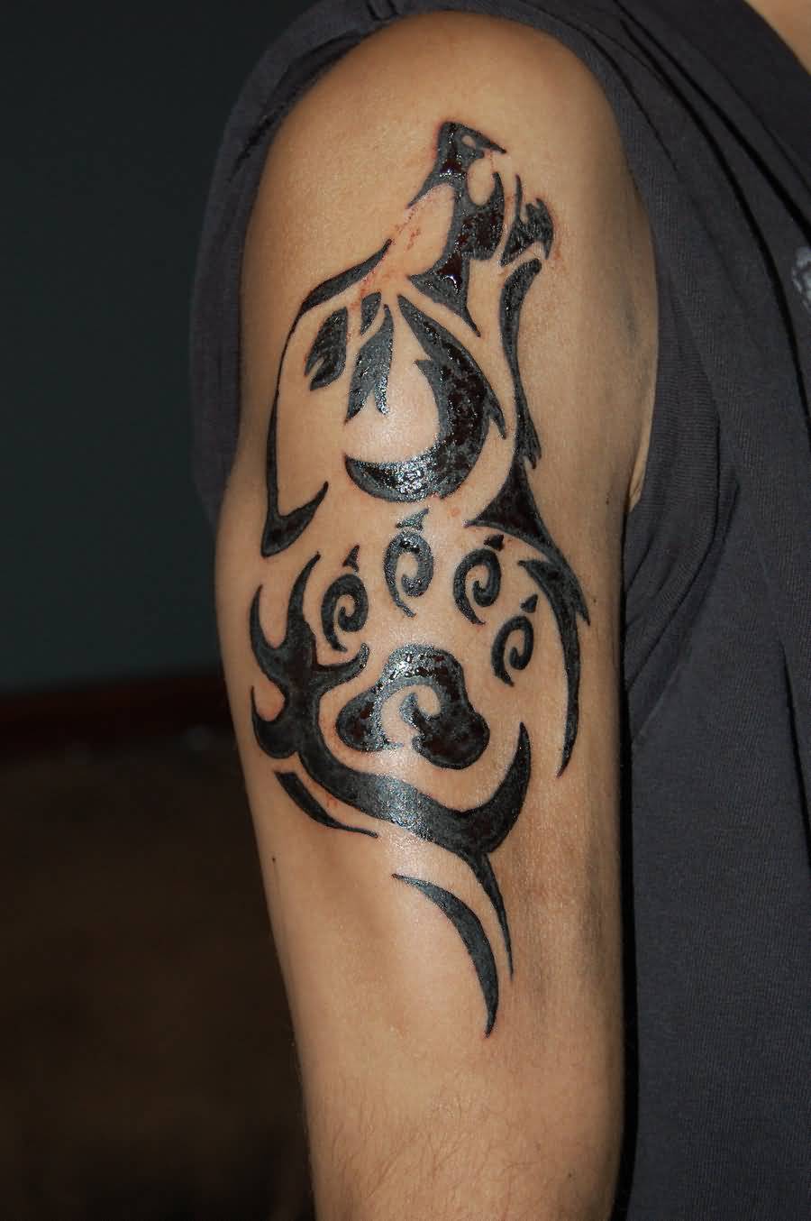 Beautiful Tribal Wolf Head With Paw Print Tattoo On Half Sleeve