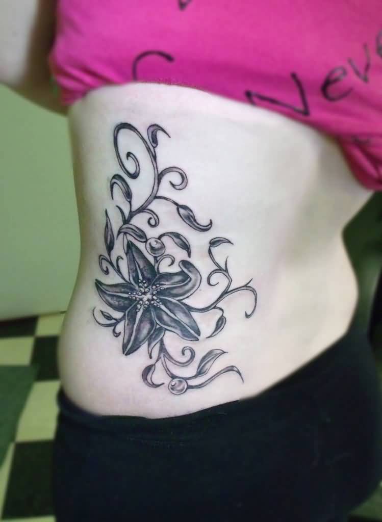 Black And Grey Starfish With Leaves Tattoo On Side Rib By Laci