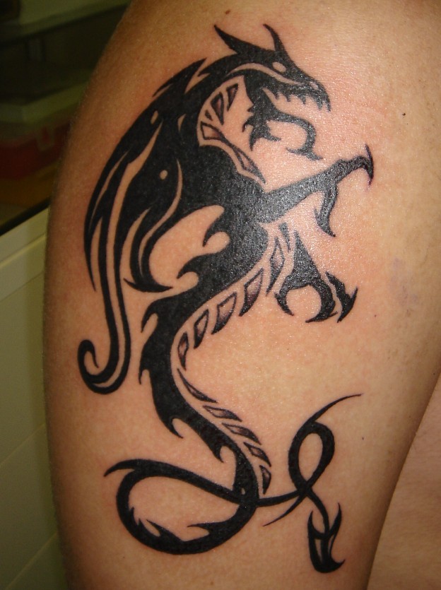 Black And Grey Tribal Dragon Tattoo