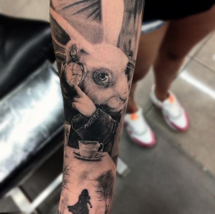 Black And White Alice In Wonderland Tattoo On Forearm