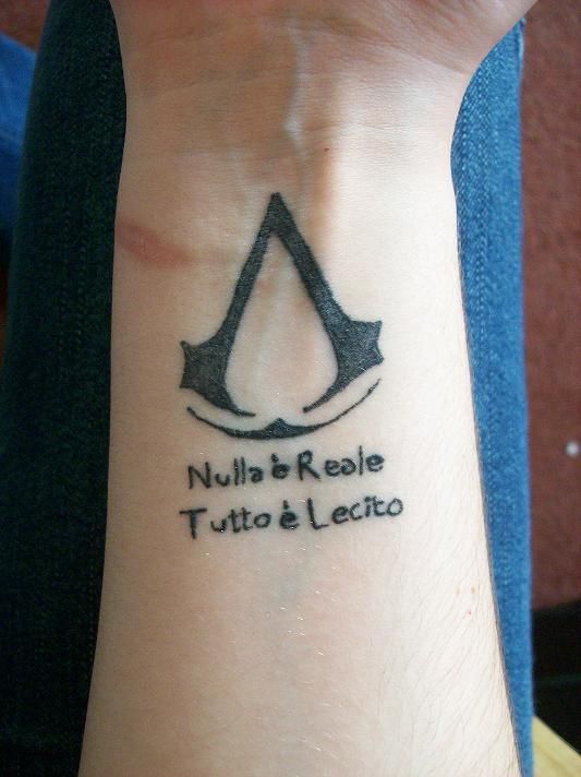 Black Ink Assassins Creed Tattoo On Wrist