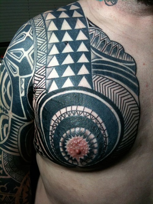 Black Ink Maori Tribal Tattoo On Right Chest And Sleeve