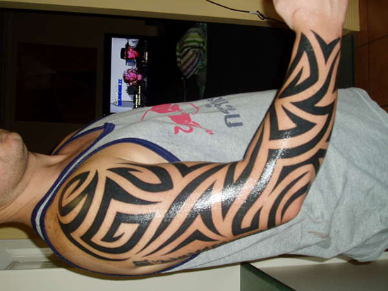Black Ink Tribal Tattoo On Right Full Sleeve For Men