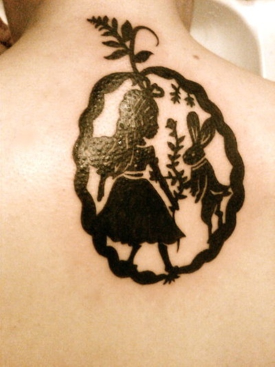 Black Silhouette Alice in Wonderland Tattoo On Upper Back