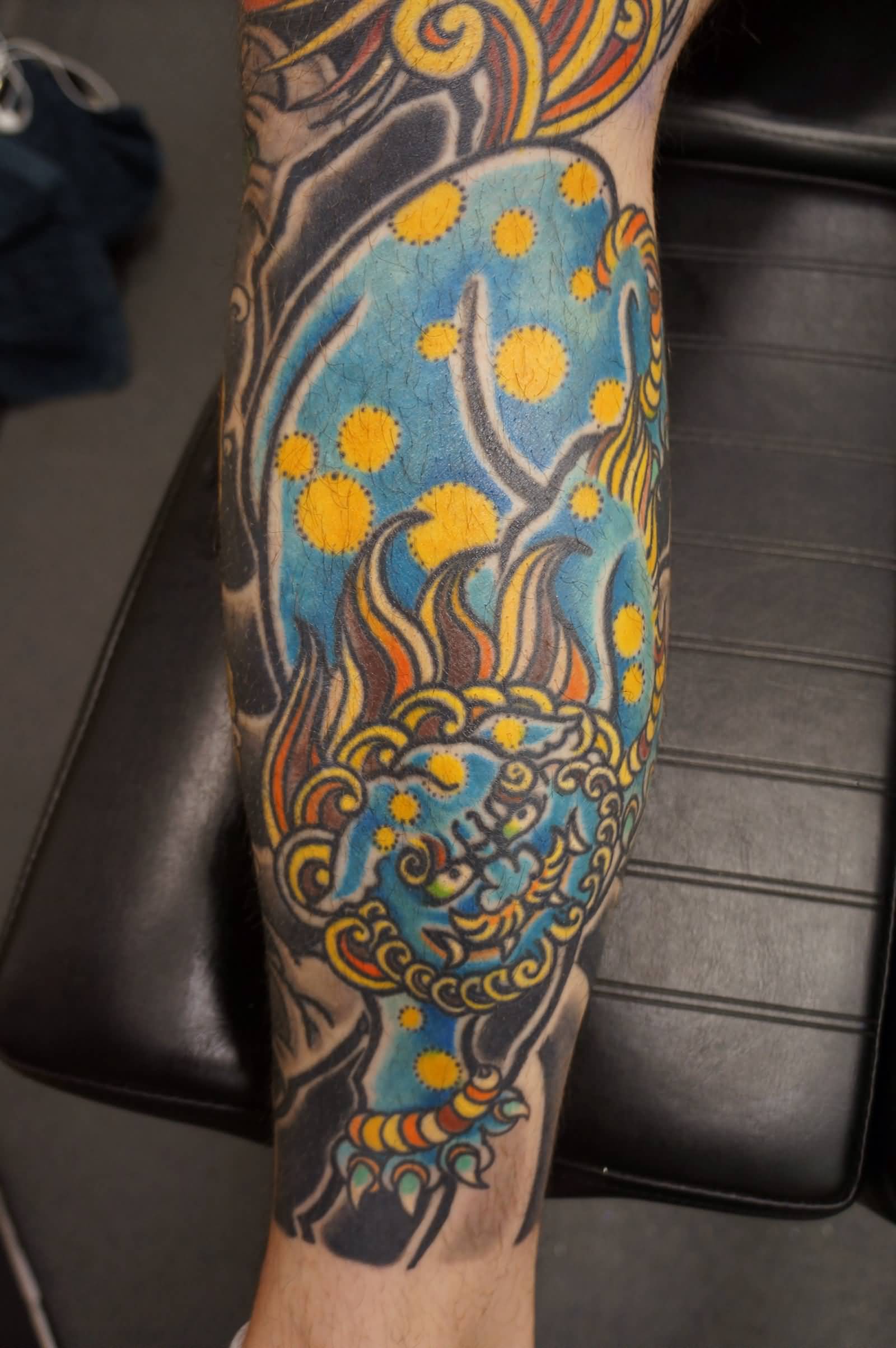 Blue Color Foo Dog Tattoo On Leg