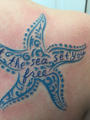 Blue Starfish With Lettering Tattoo On Right Back Shoulder