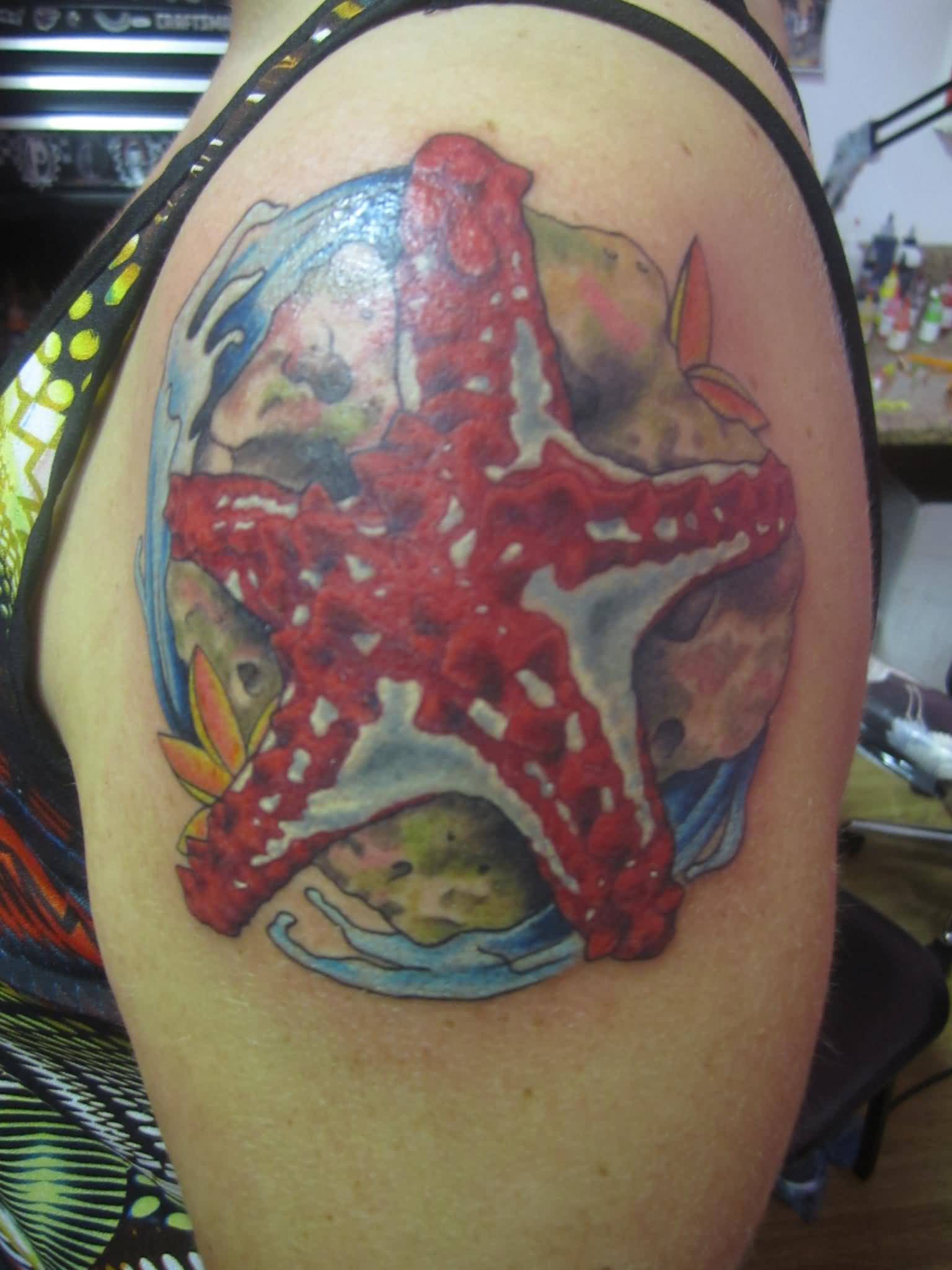 Brilliant Starfish With Water Tattoo On Left Shoulder