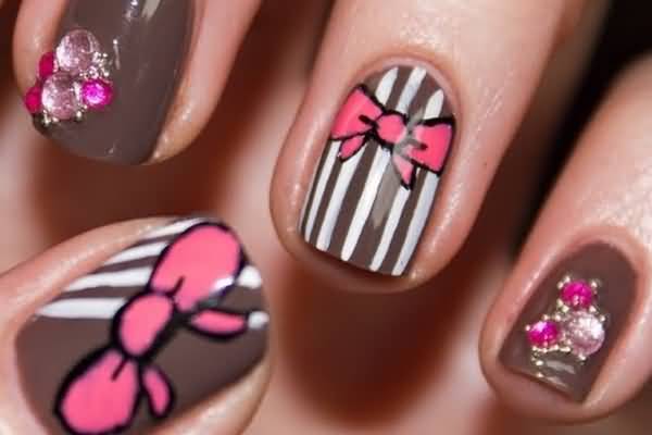 Brown And White Stripes Nail Art With Pink Bow Design