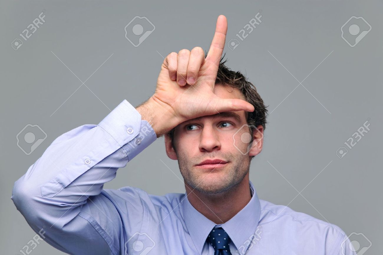 Businessman Making A Loser Gesture With His Hand