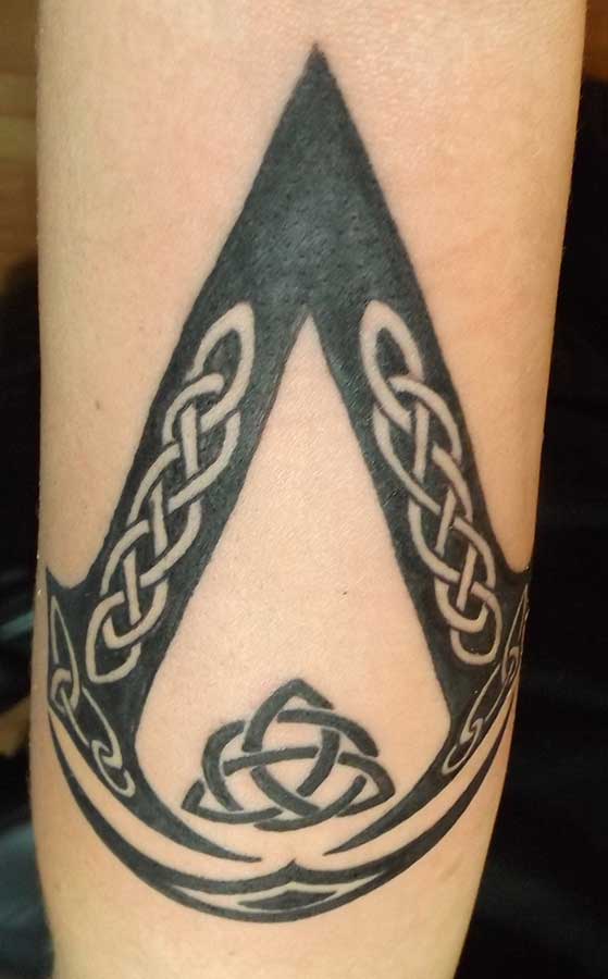 Celtic Assassins Creed Tattoo On Sleeve
