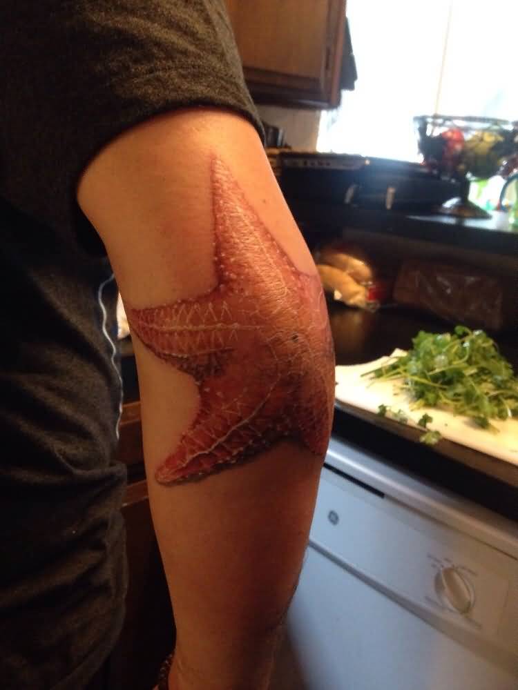 Color Ink Starfish Tattoo On Elbow