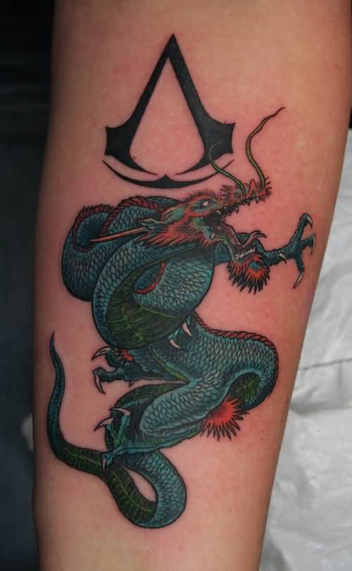 Colored Dragon And Assassins Creed Tattoo On Leg