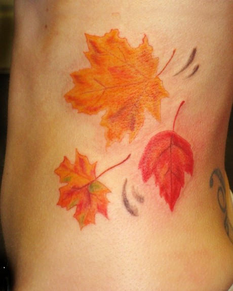 Colored Fall Leaves Tattoos On Side Rib