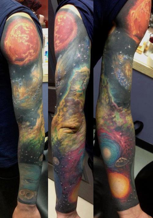 Colored Universe Tattoo On Man Left Sleeve