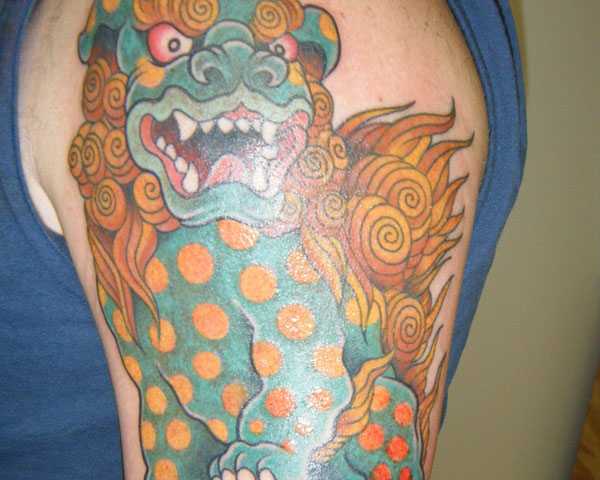 Colorful Angry Foo Dog With Dots On Body Tattoo On Left Half Sleeve
