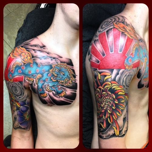 Colorful Angry Foo Dog With Flowers Tattoo On Chest