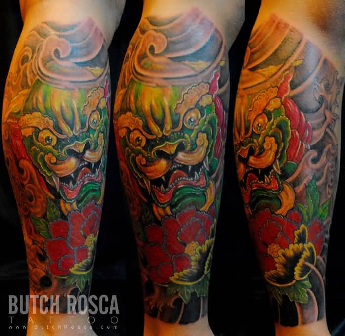 Colorful Angry Foo Dog With Red Flower Tattoo On Leg