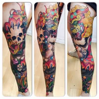 Colorful Chinese Foo Dog Holding Skull Tattoo On Leg