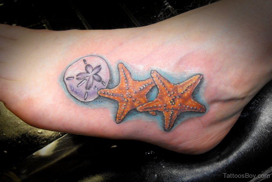 Colorful Starfish With Sand Dollar Tattoo On Foot