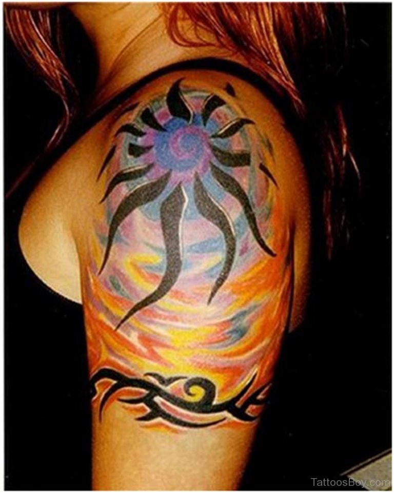 Colorful Tribal Sun And Design Tattoo On Left Shoulder