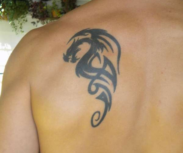 Cool And Small Tribal Dragon Tattoo On Left Back Shoulder
