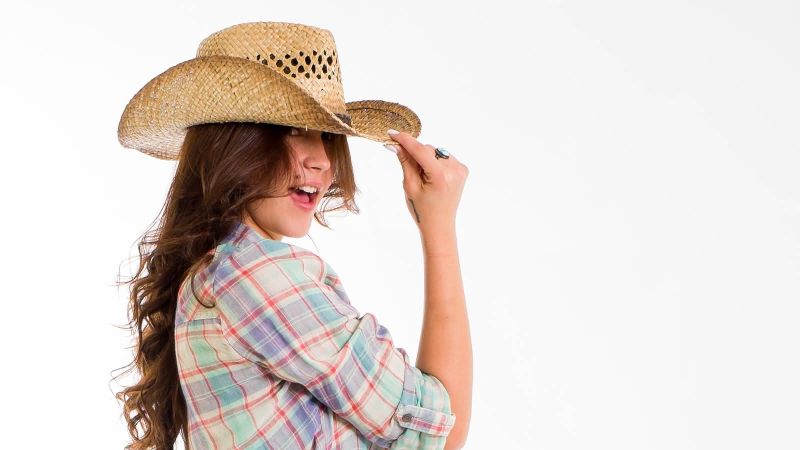 Country Girl Posing With Cowboy Hat Picture