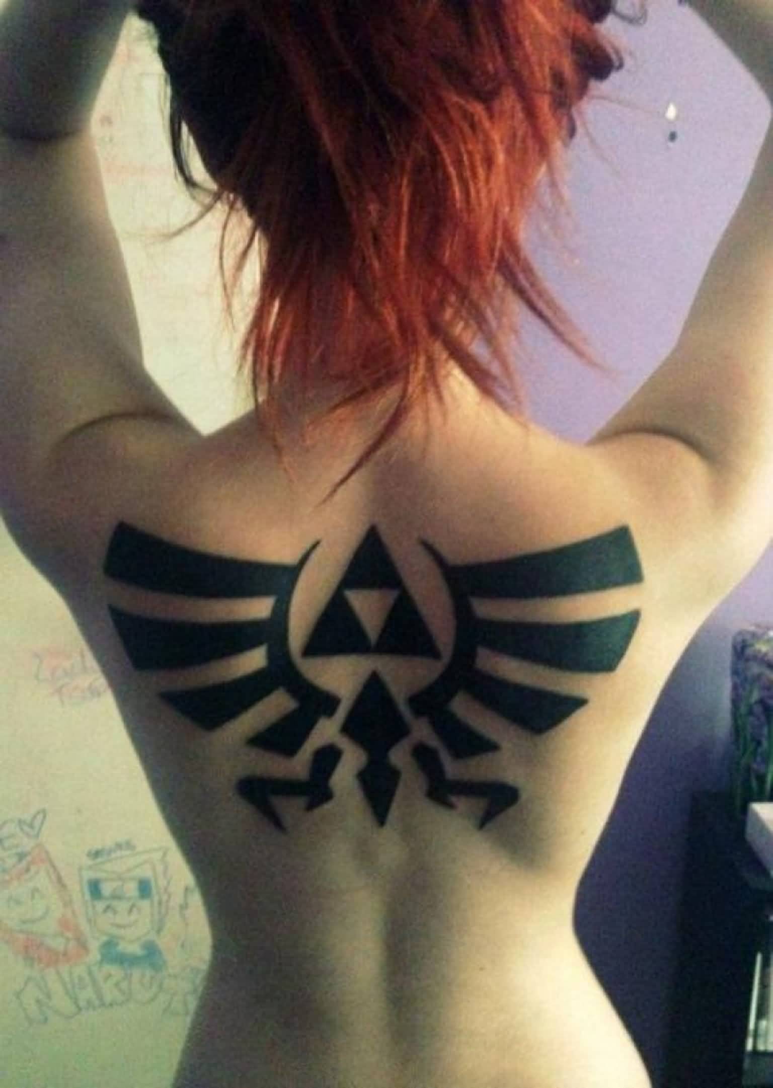 Creative Dark Ink Tribal Tattoo On Upper Back For Women
