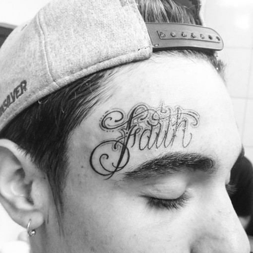Faith Lettering Chicano Tattoo On Forehead by Henry Frota