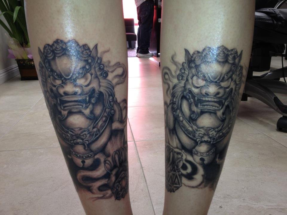 Fresh Ink Grey Foo Dogs Tattoo On Back Legs By Tommy