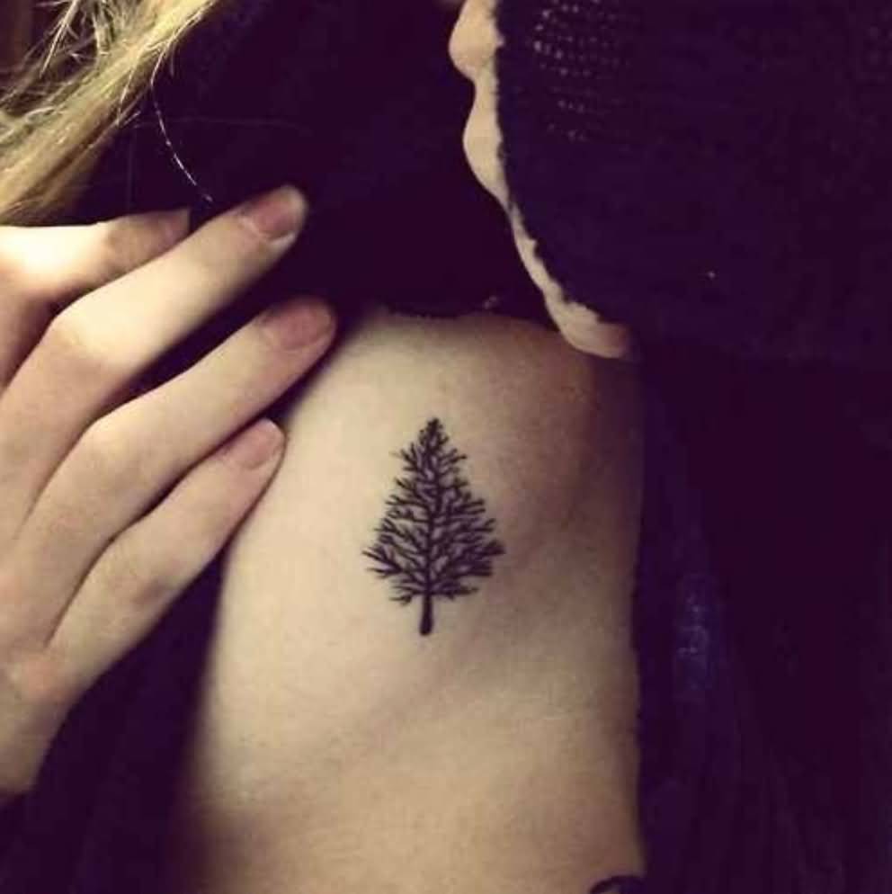 Girl Showing Fall Tree Tattoo On Side Rib