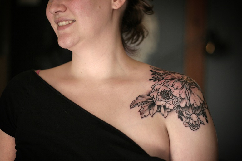Grey Flower Tattoo On Girl Left Clavicle