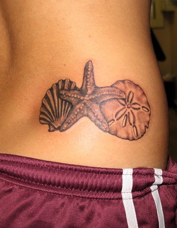Grey Ink Conch And Tribal Starfish Tattoo On Lower Back