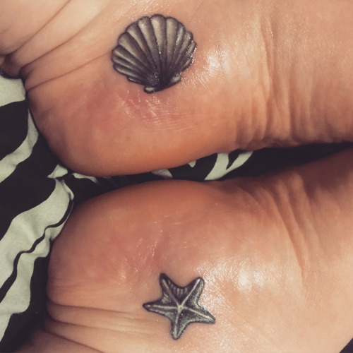 Grey Ink Sea Shell With Starfish Traditional Tattoo On Both Foots