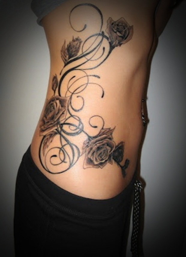 Incredible Rose Flowers With Tribal Design Tattoo On Right Side Rib