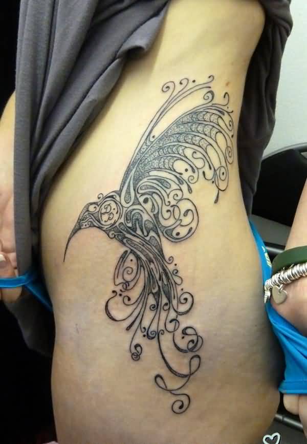 Incredible Tribal Bird Tattoo On Side Rib For Women
