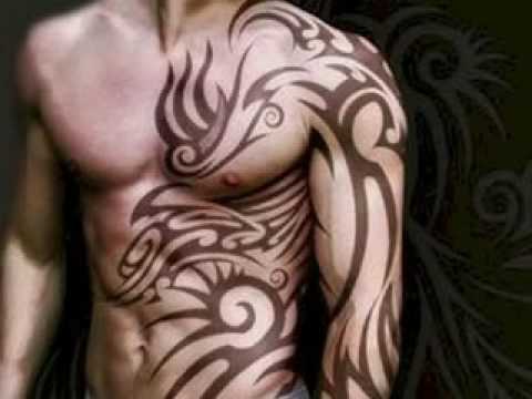 Light Brown Color Tribal Design Tattoo On Left Side Rib And Full Sleeve