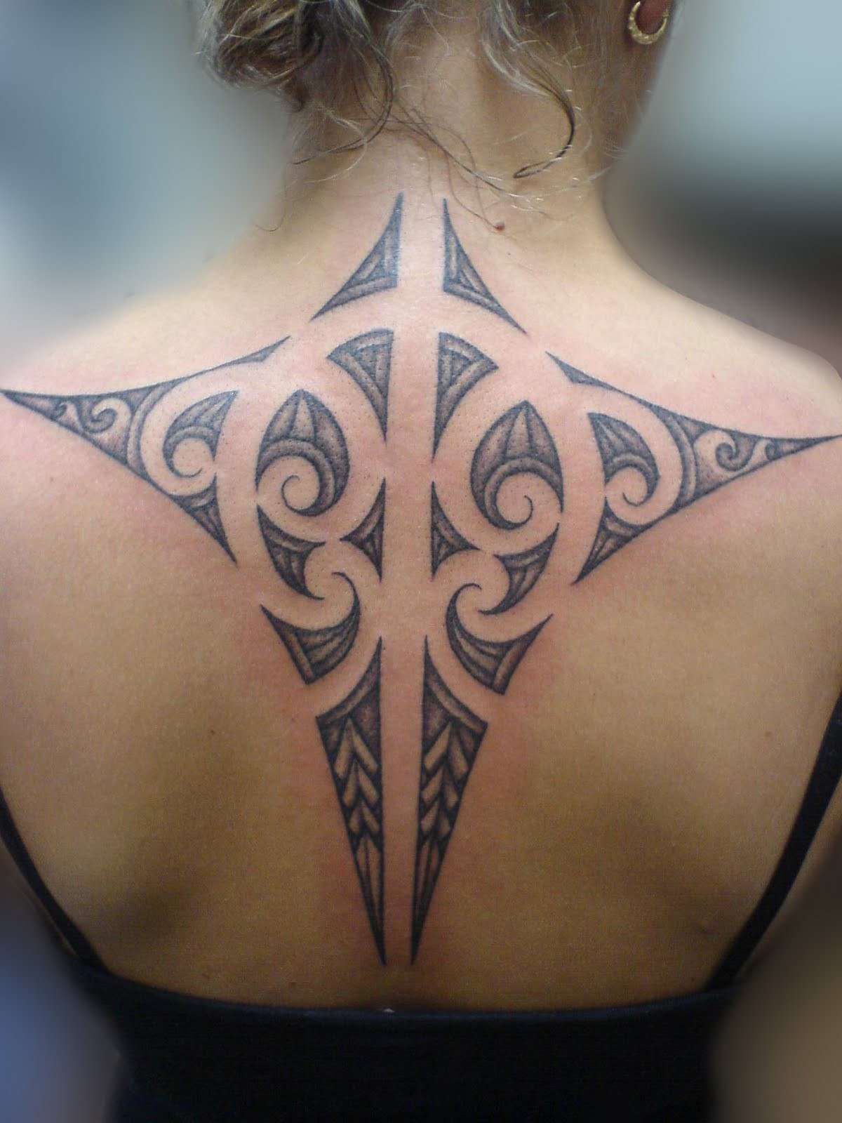 Magnificent Maori Tribal Tattoo On Upper Back For Women
