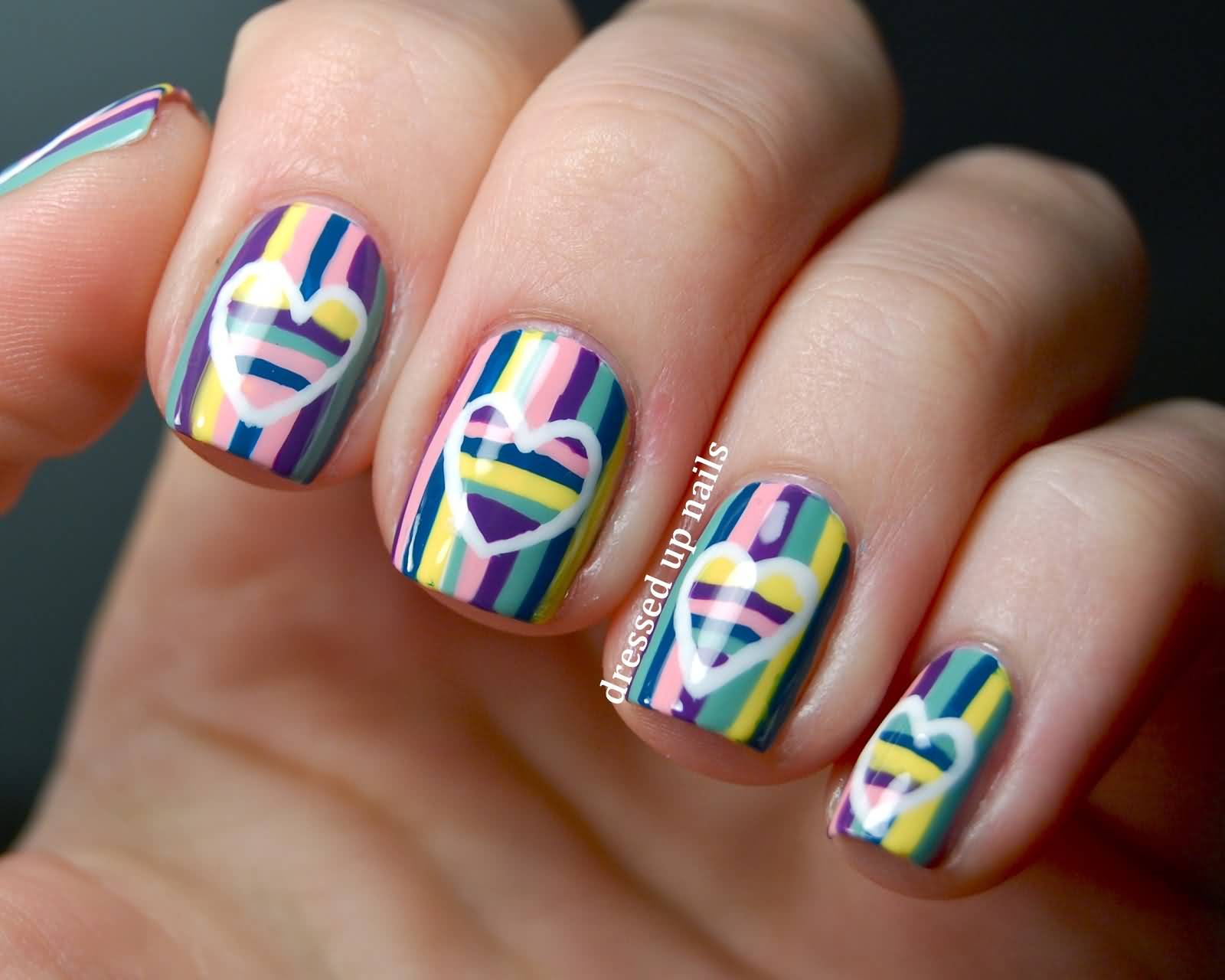 Multicolored Stripes Nail Art With White Heart Design