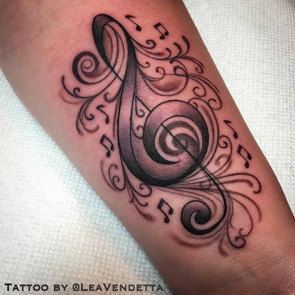 Music tattoo on forearm by Lea Vendetta