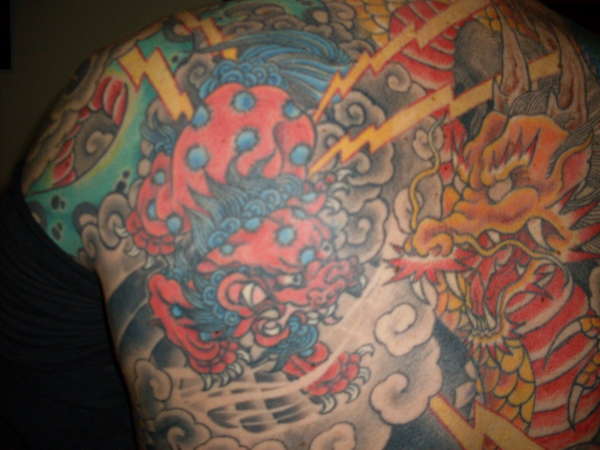 Nice Colorful Foo Dog With Dragon Tattoo On Full Back
