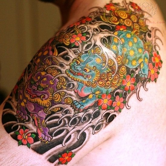 Nice Colorful Foo Dogs With Flowers Tattoo On Left Upper Shoulder