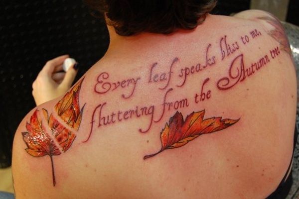 Nice Leaves With Lettering Fall Tattoo On Upper Back