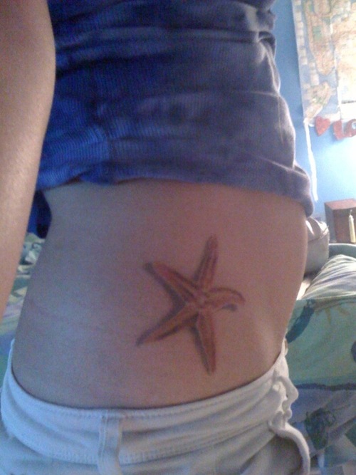 Nice Orange Starfish Tattoo On Waist